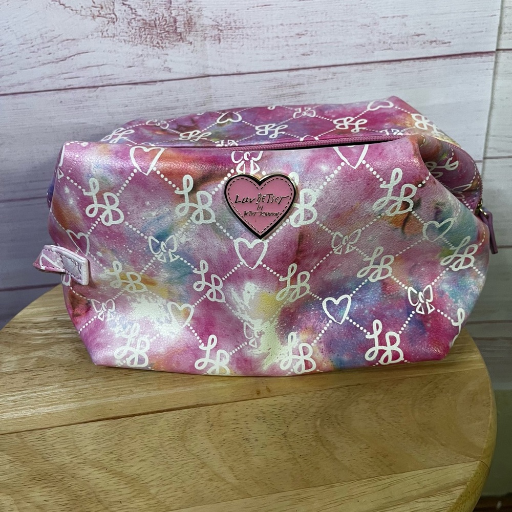 Luv Betsey Johnson Loaf Cosmetic Bag in a‎ tie-dye print with a heart logo